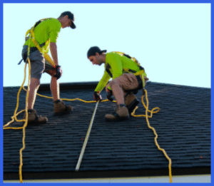 Safety-conscious roofers with proper harness equipment