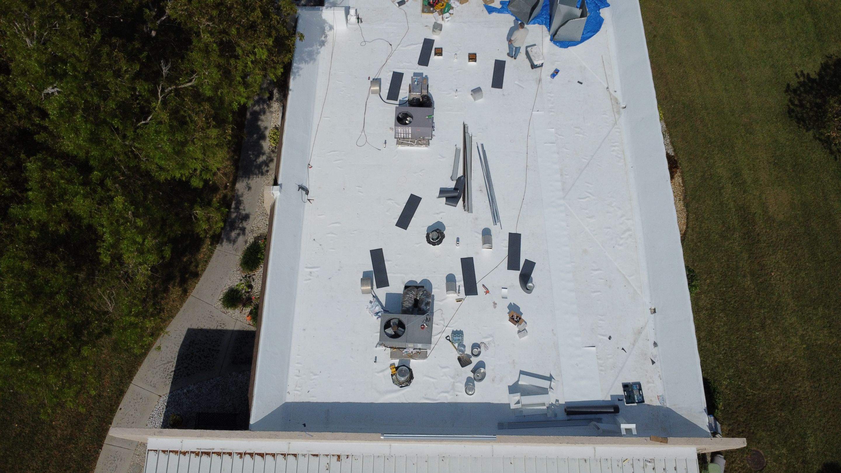 Aerial overview of building with completed roofing services