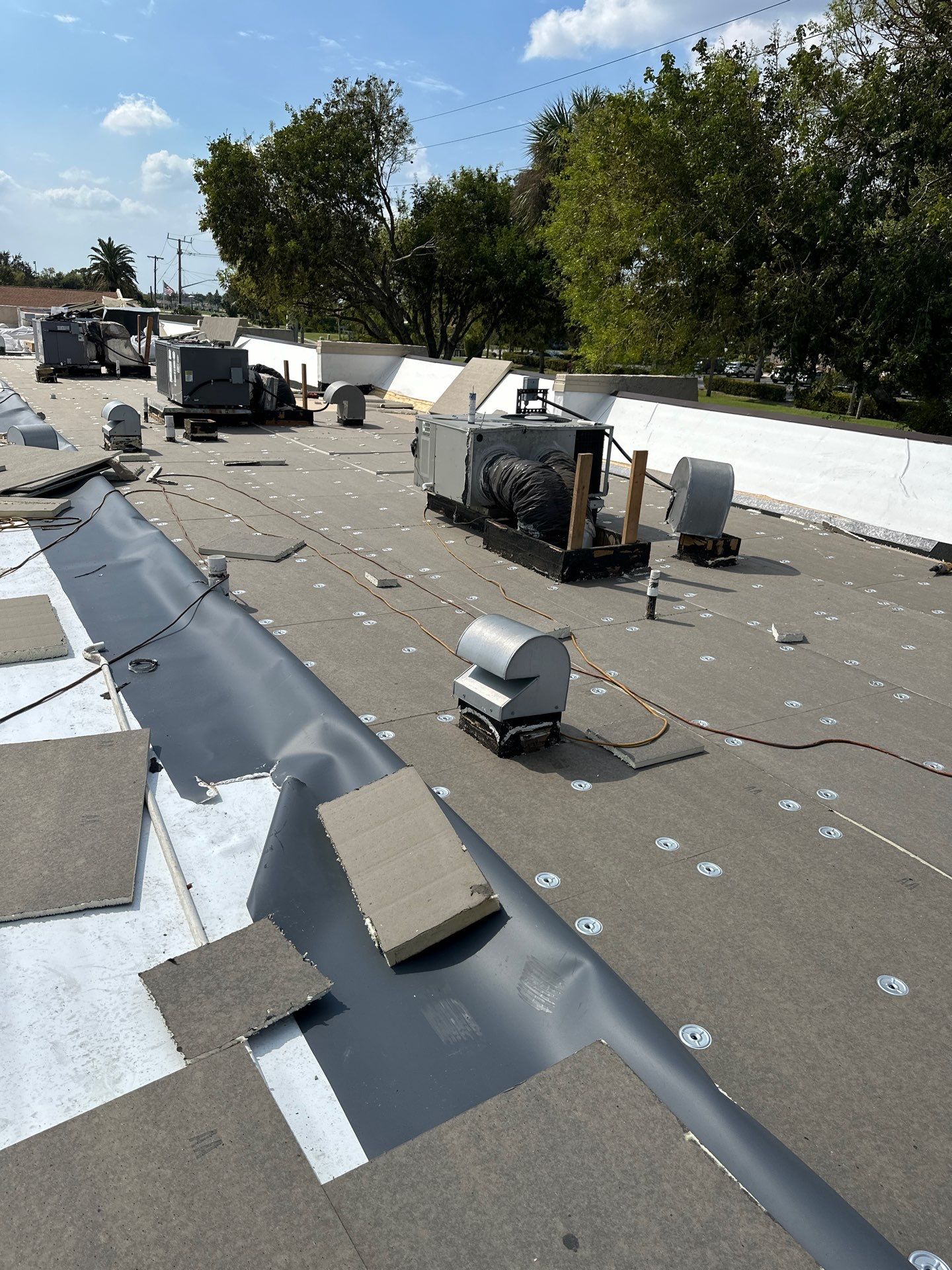 Neighborhood overview showing multiple roofing projects