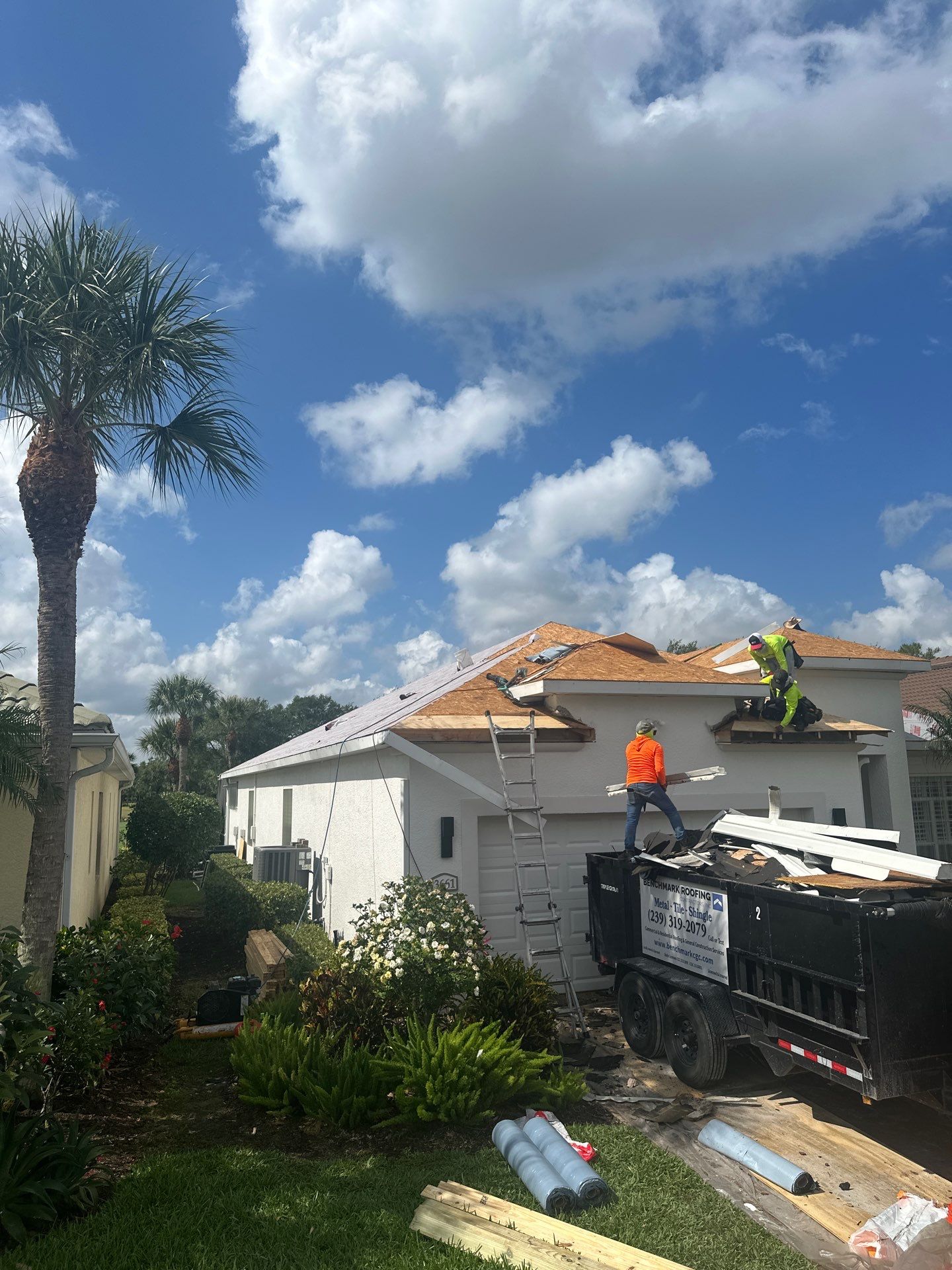 Professional construction crew working on roofing project